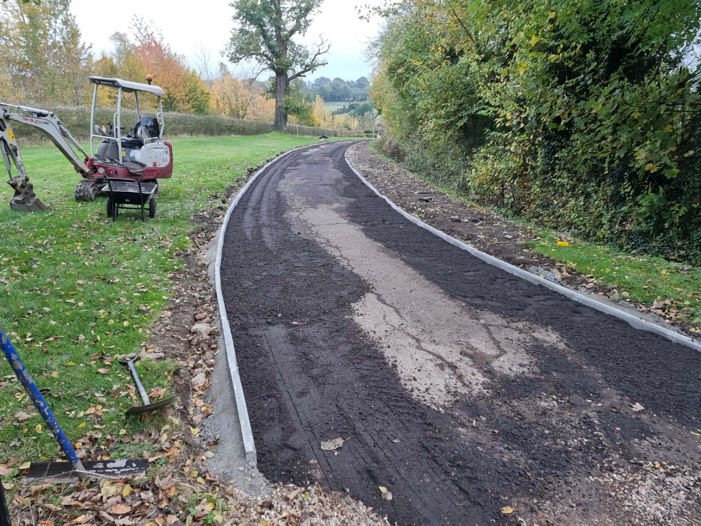 This is a large driveway which is in the process of having a tar and chip driveway installed on by Wymondham Driveway Contractors