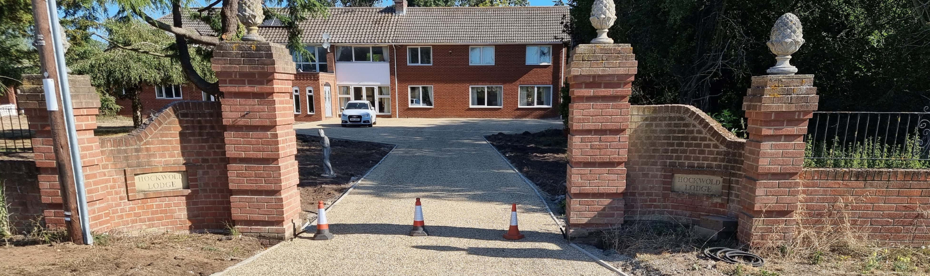 This is a photo of a newly installed tar and chip driveway installed by Wymondham Driveway Contractors